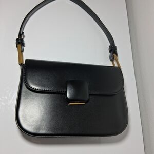 Sleek Black Shoulder Bag with Gold Accents